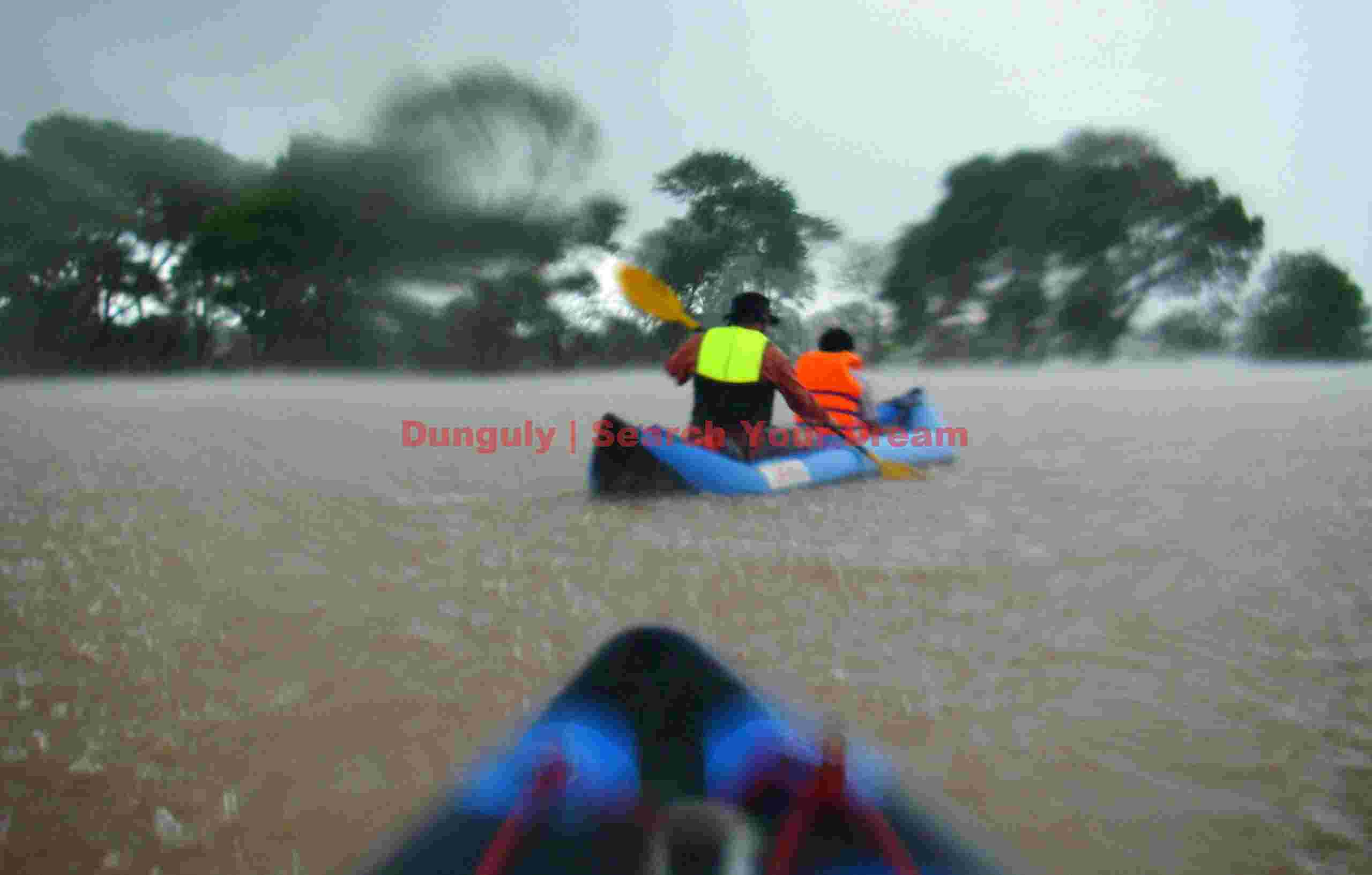 Kayaking in downpour; 4000 islands, Mekong River, Cambodia Kayaking in downpour