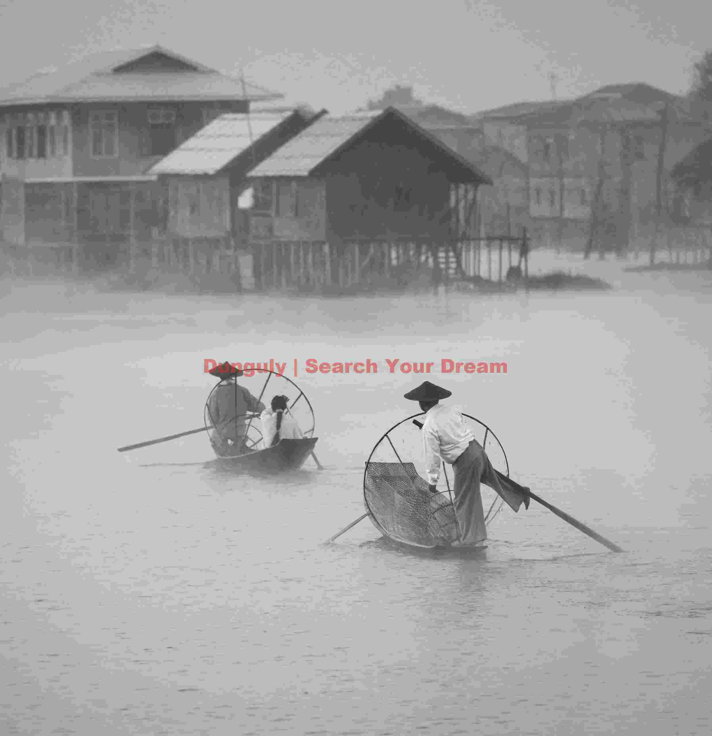 Leg-rowing fishermen in mist; Inle Lake, Burma Leg-rowing fishermen in mist