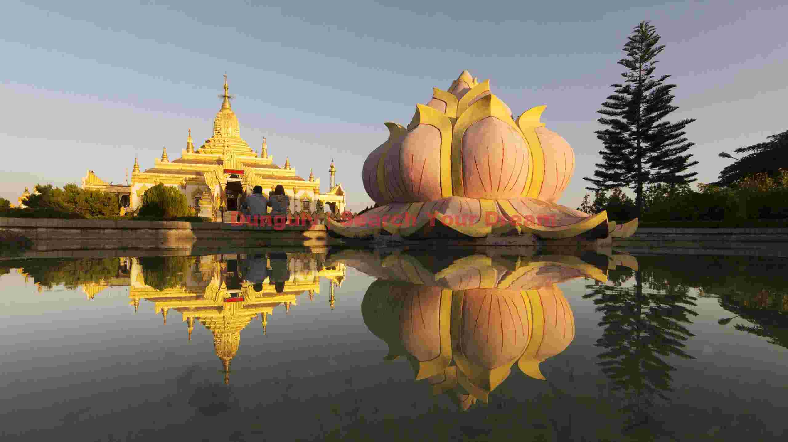 Reflections of pagoda and lotus flower sculpture; Burma Reflections of pagoda and lotus flower sculpture