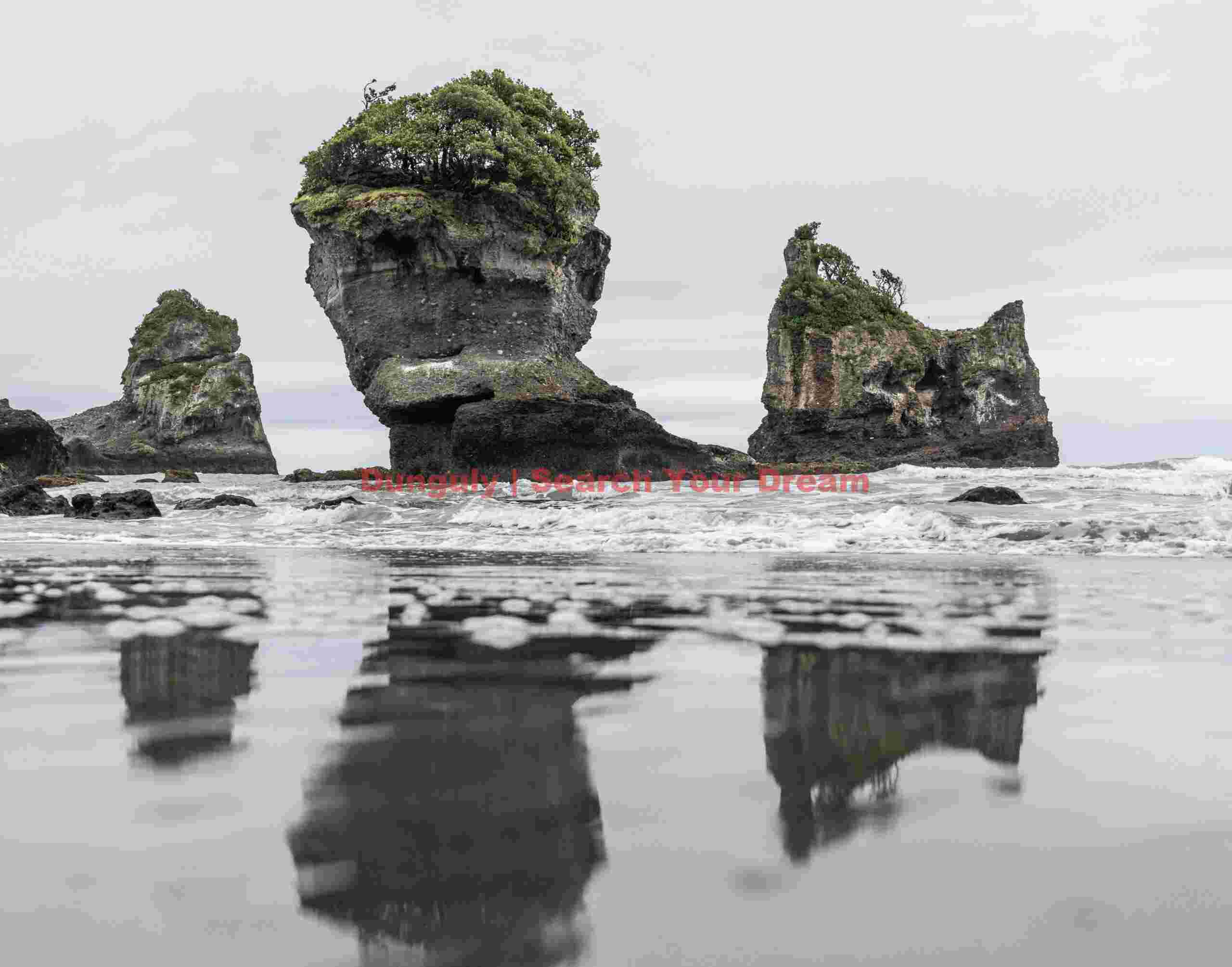 Sea stack reflections; Motukieki Beach, South Island, New Zealand Sea stack reflections