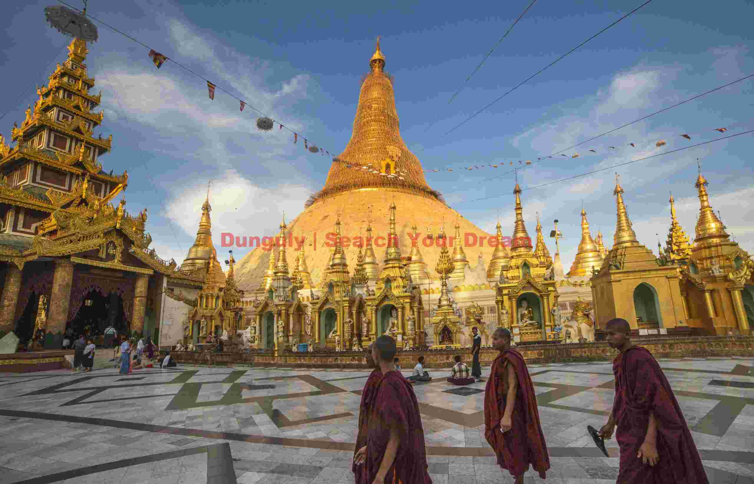 Shwedagon Pagoda overview with monks; Yangon, Burma Shwedagon Pagoda overview with monks
