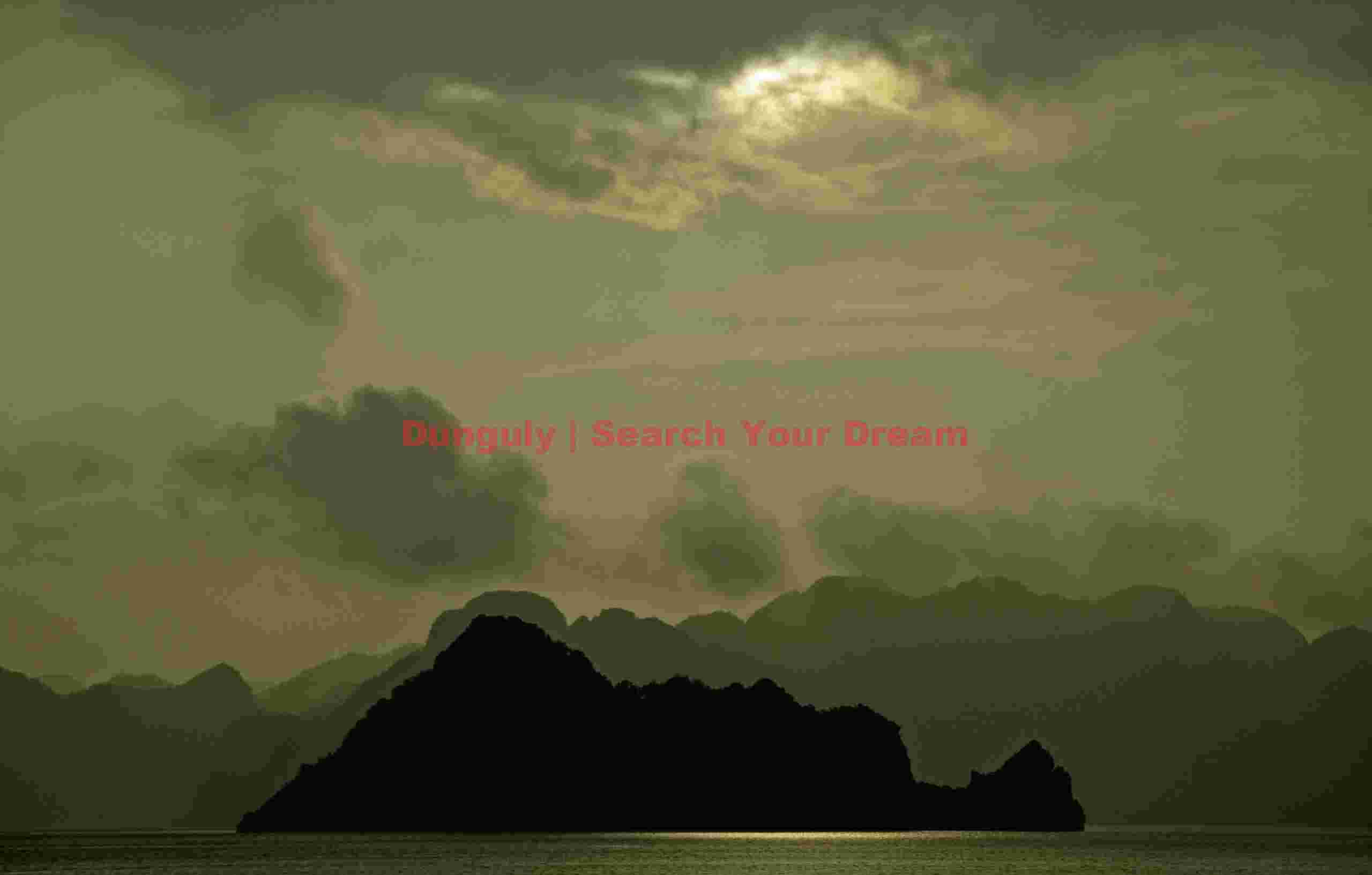 Sunset through clouds; Ha Long Bay, Vietnam Sunset through clouds