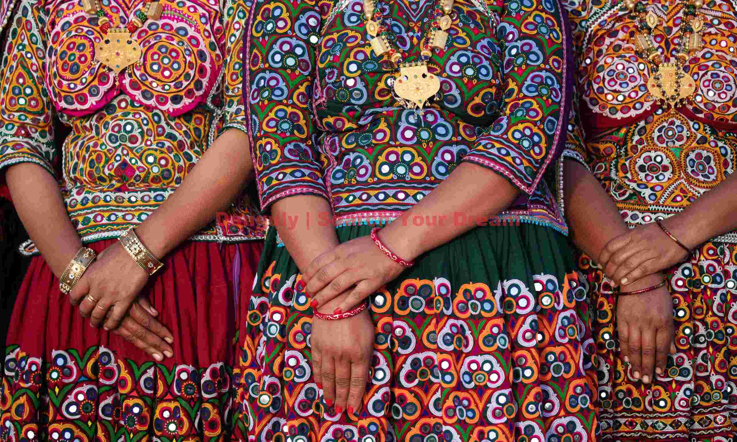 Three pairs of clasped hands; Ahir tribe, Rann of Kutch, India Three pairs of clasped hands
