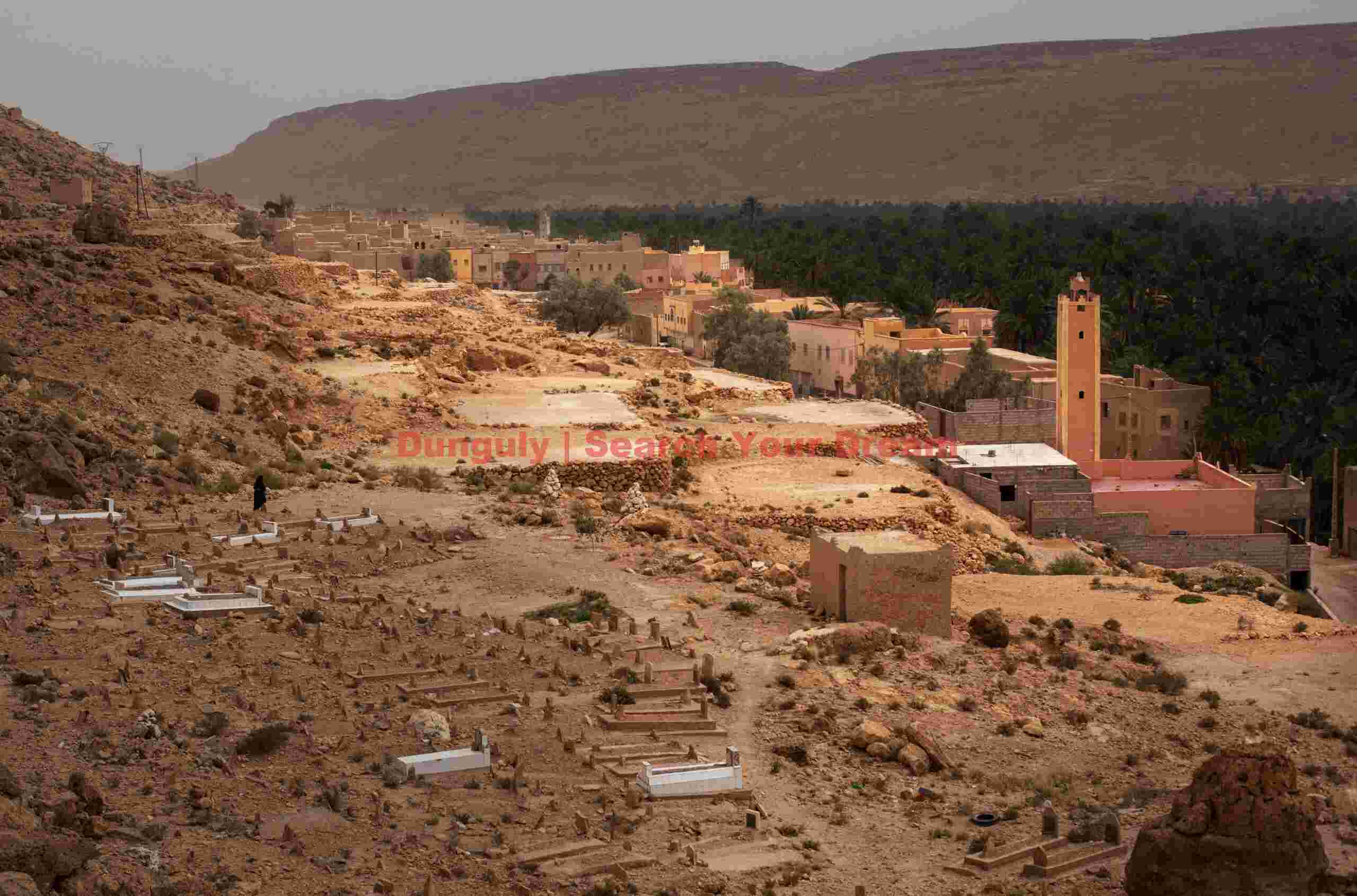Berber town and cemetery; Atlas Mountains, Morocco Berber town and cemetery