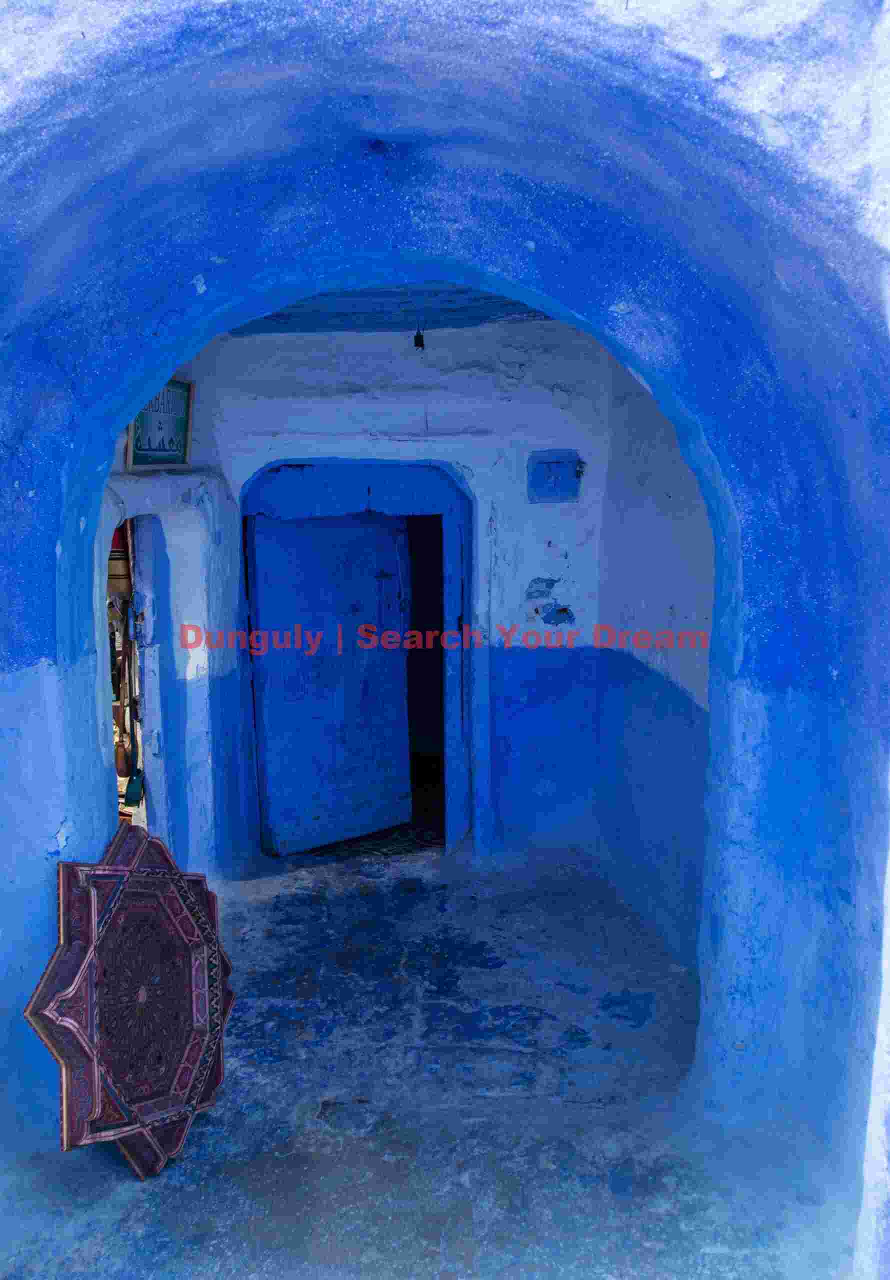 Blue door in blue archway; mChefchaouen, Morocco Blue door in blue archway