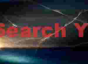 Prion light-trailsover water by ship's searchlight