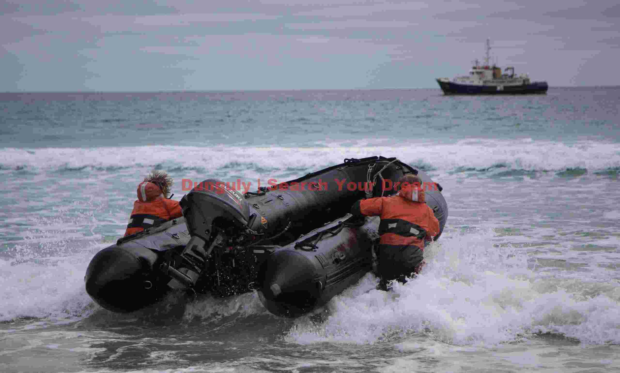 Pushing out the Zodiac; The Neck of Saunders Island, Falklands Pushing out the Zodiac