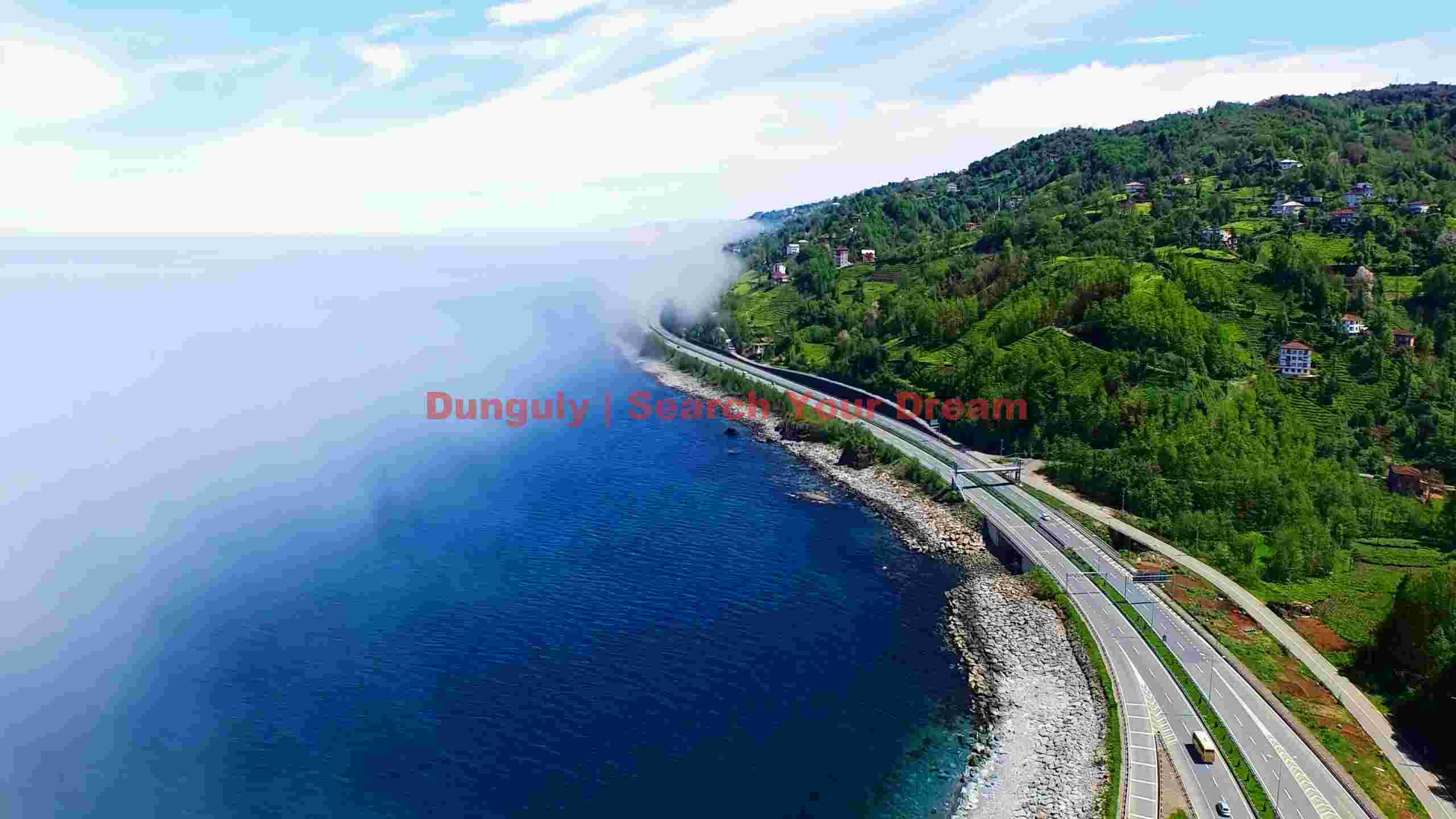 coastal highway where lush hills meet mystical sea fog coastal highway where lush hills meet mystical sea fog