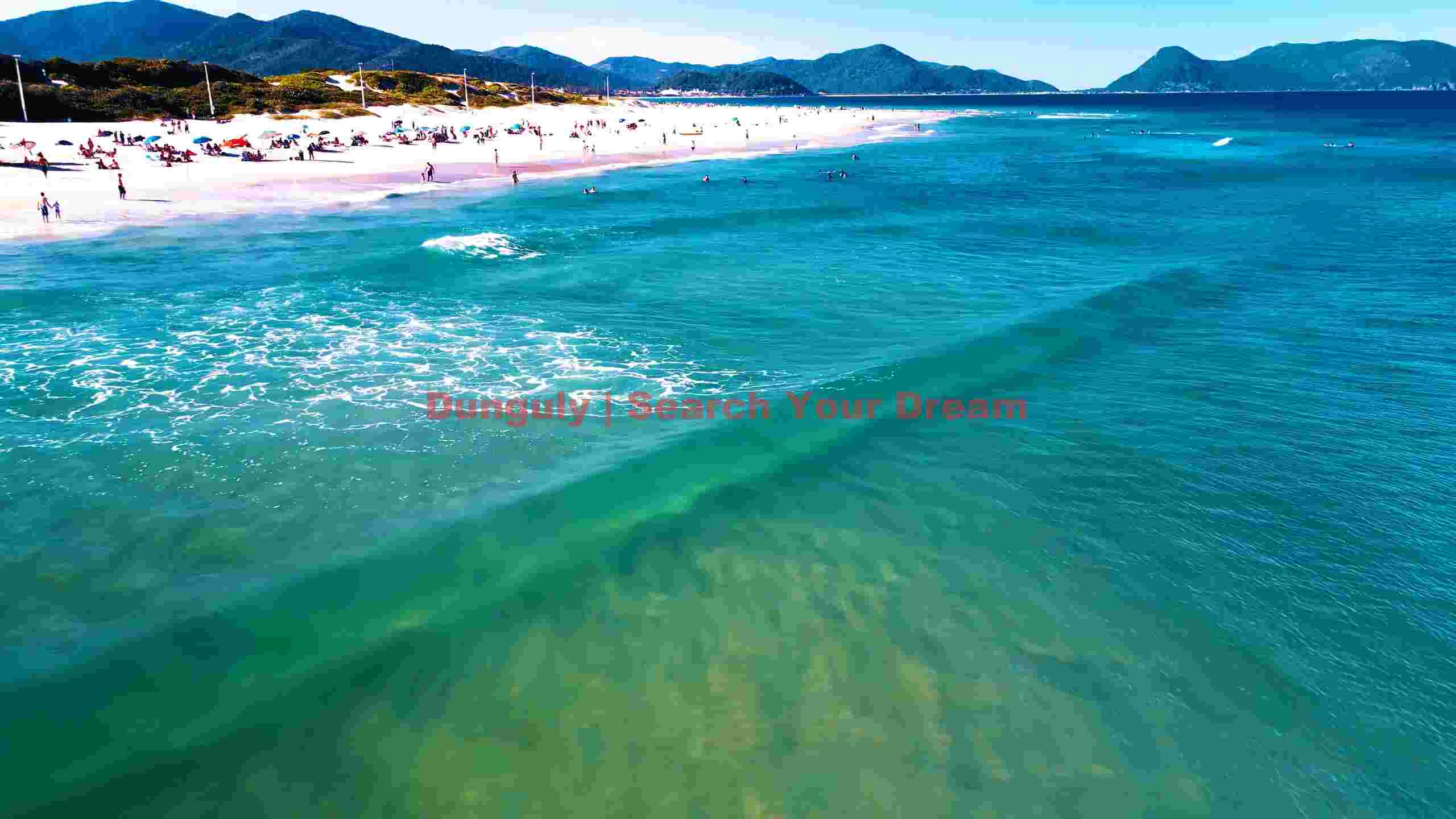 vibrant tropical beach day with crystal waters & mountains vibrant tropical beach day with crystal waters & mountains
