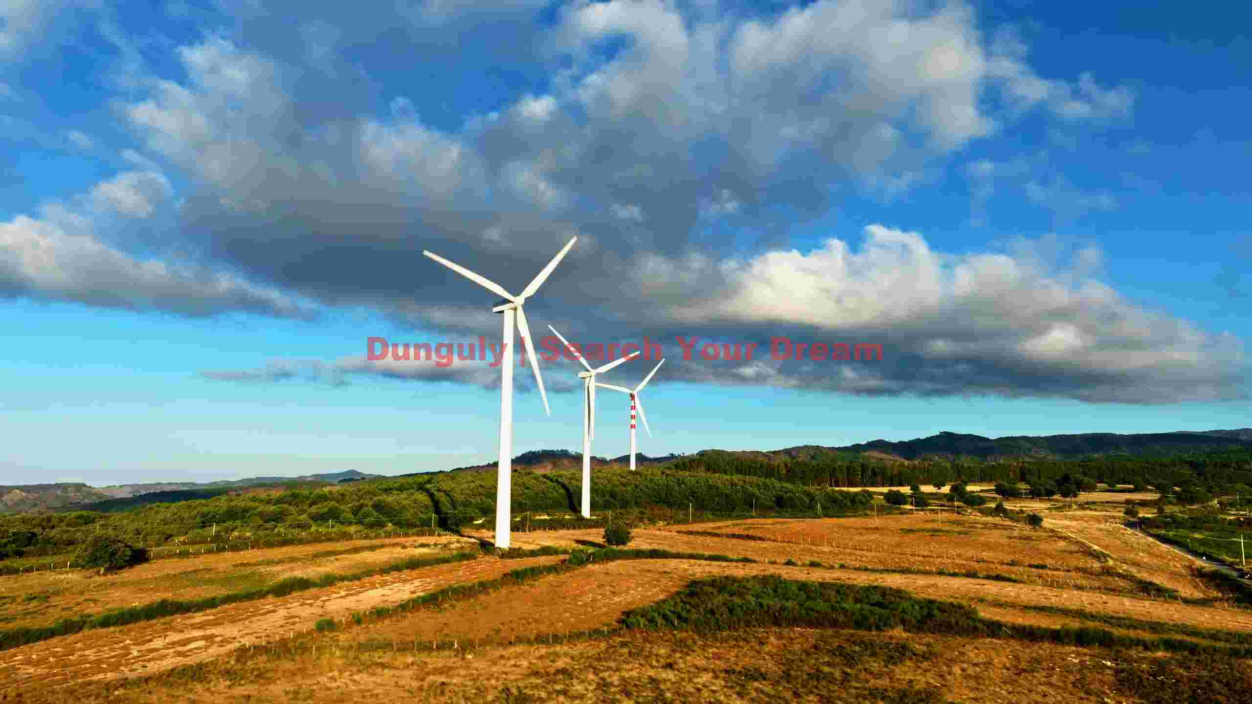 wind turbines against a dramatic sky wind turbines against a dramatic sky
