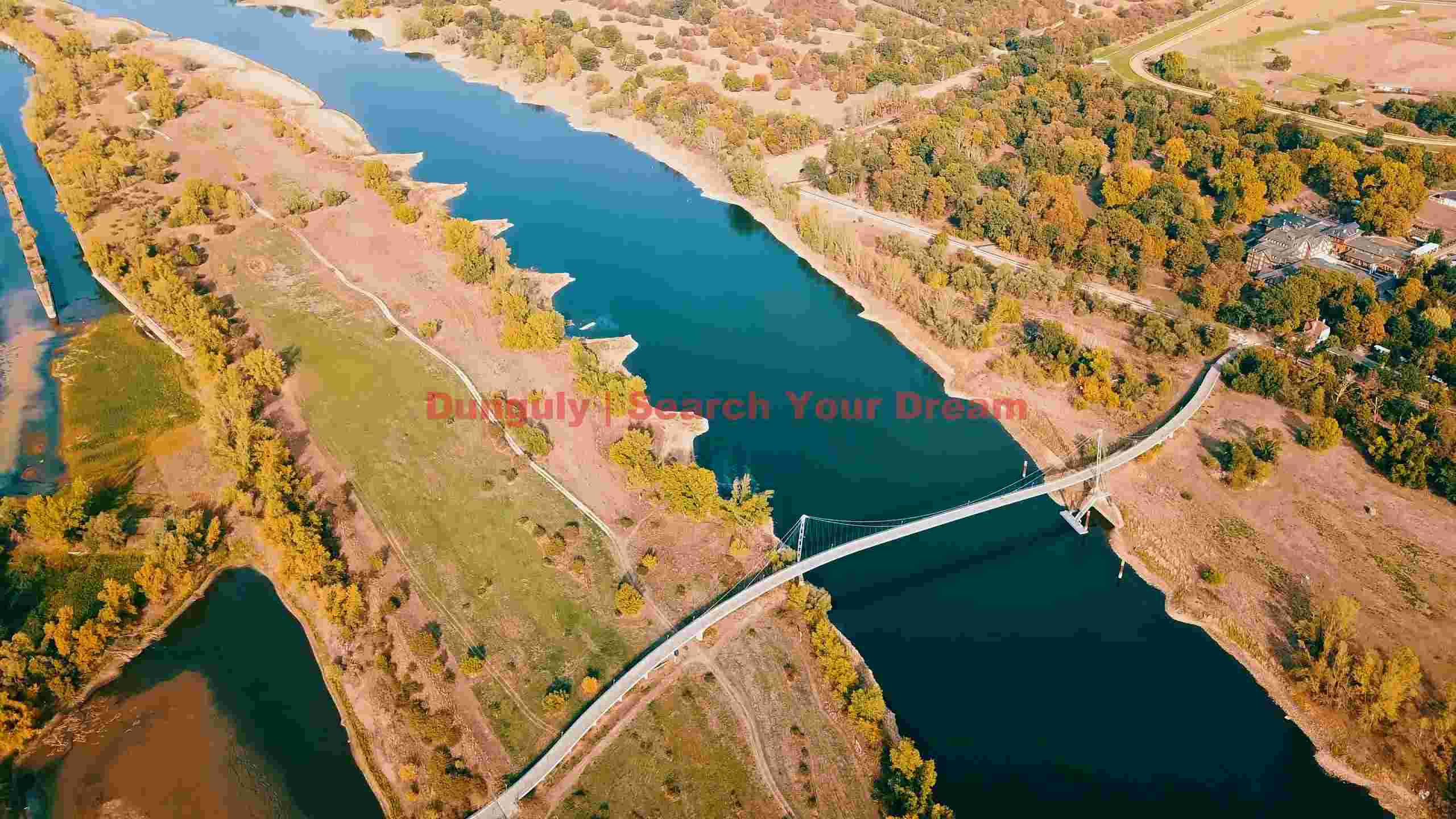 aerial autumn river landscape with suspension bridge aerial autumn river landscape with suspension bridge