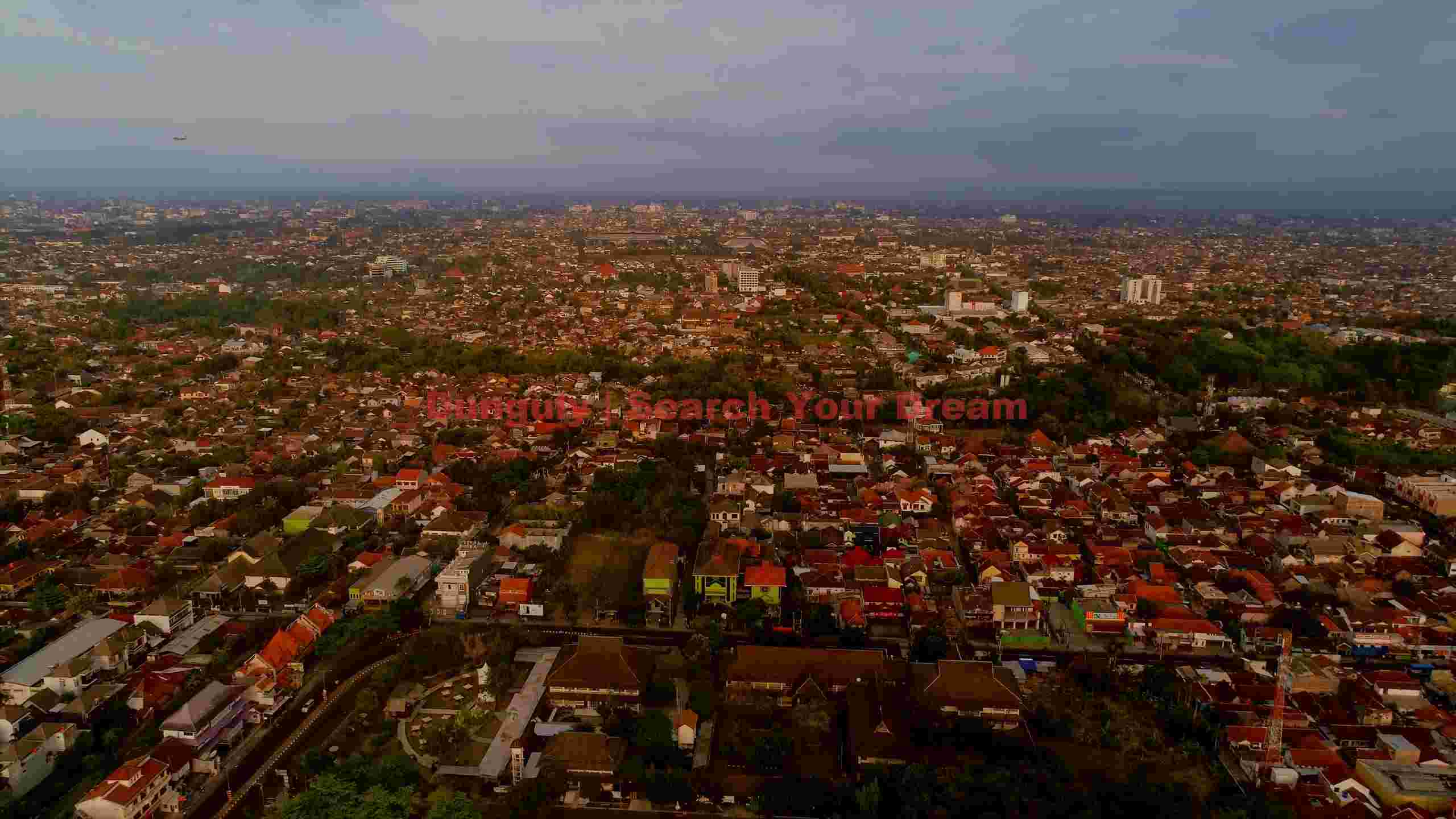aerial panorama of a sprawling cityscape at dusk aerial panorama of a sprawling cityscape at dusk