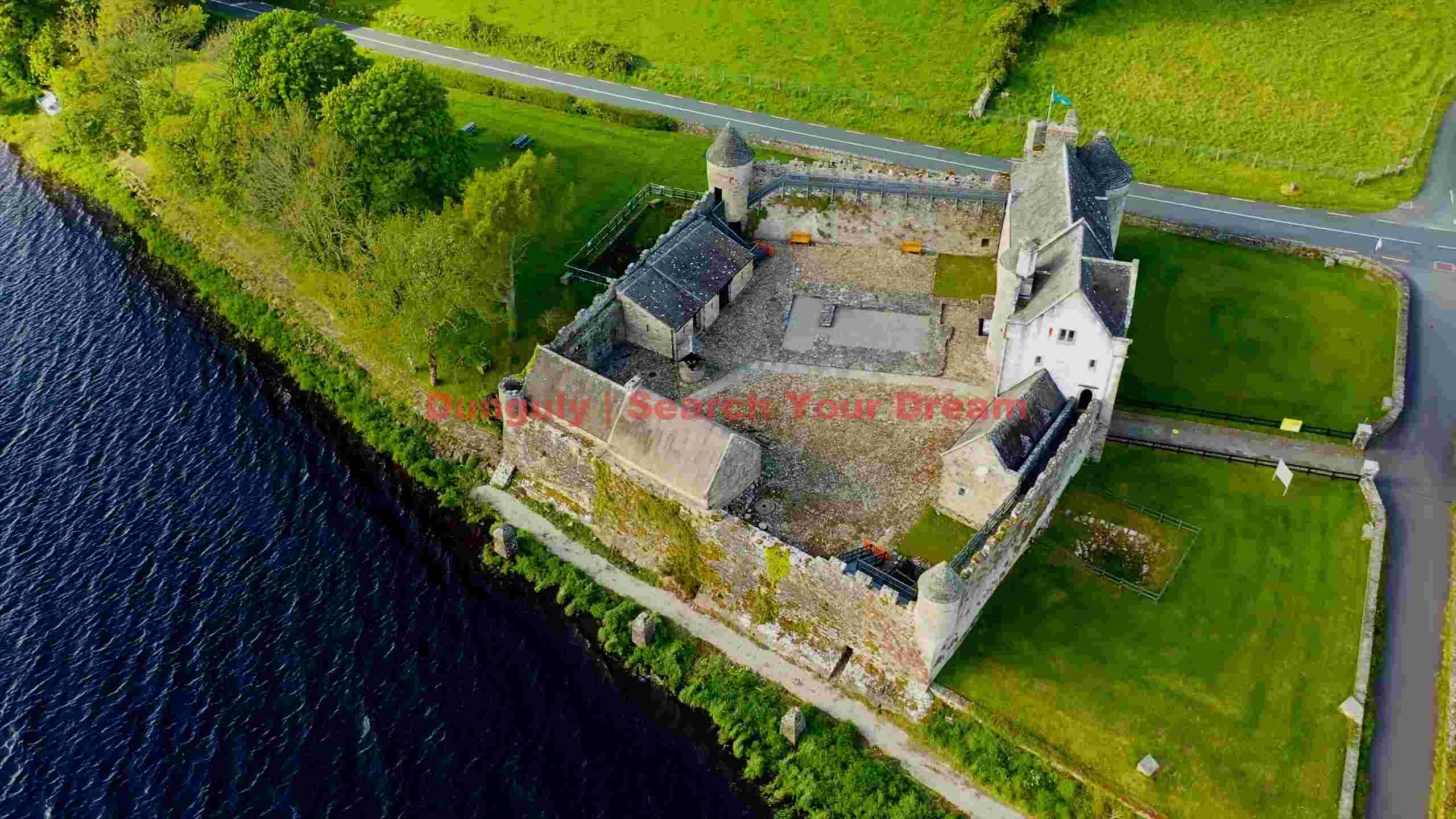 aerial serenity ancient castle by the loch aerial serenity ancient castle by the loch