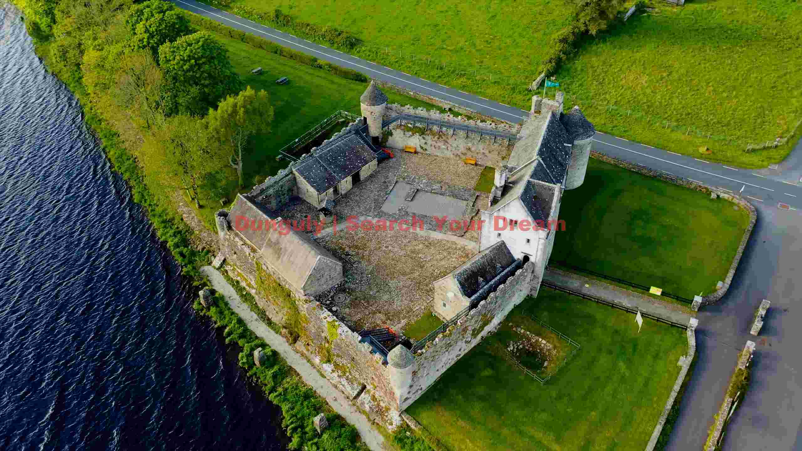 aerial view of historic lakeside castle aerial view of historic lakeside castle