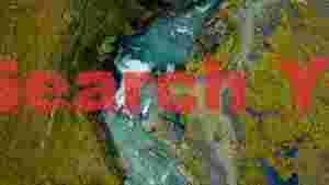At Home aerial view of rushing waterfall and river landscape