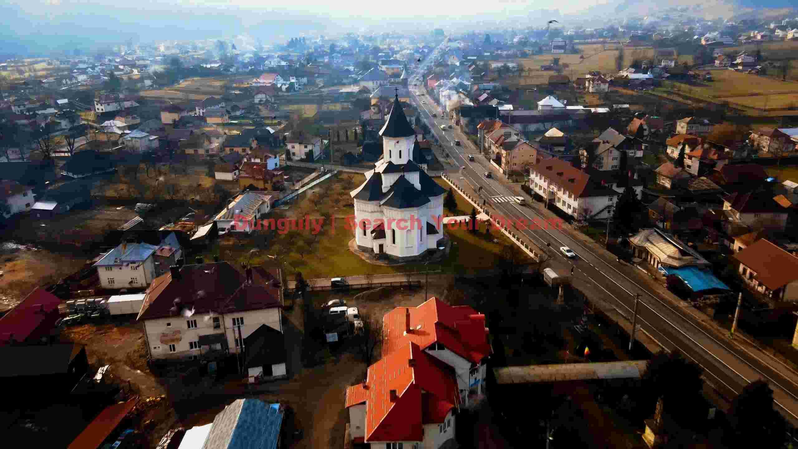 aerial view of a picturesque european village with historic church aerial view of a picturesque european village with historic church