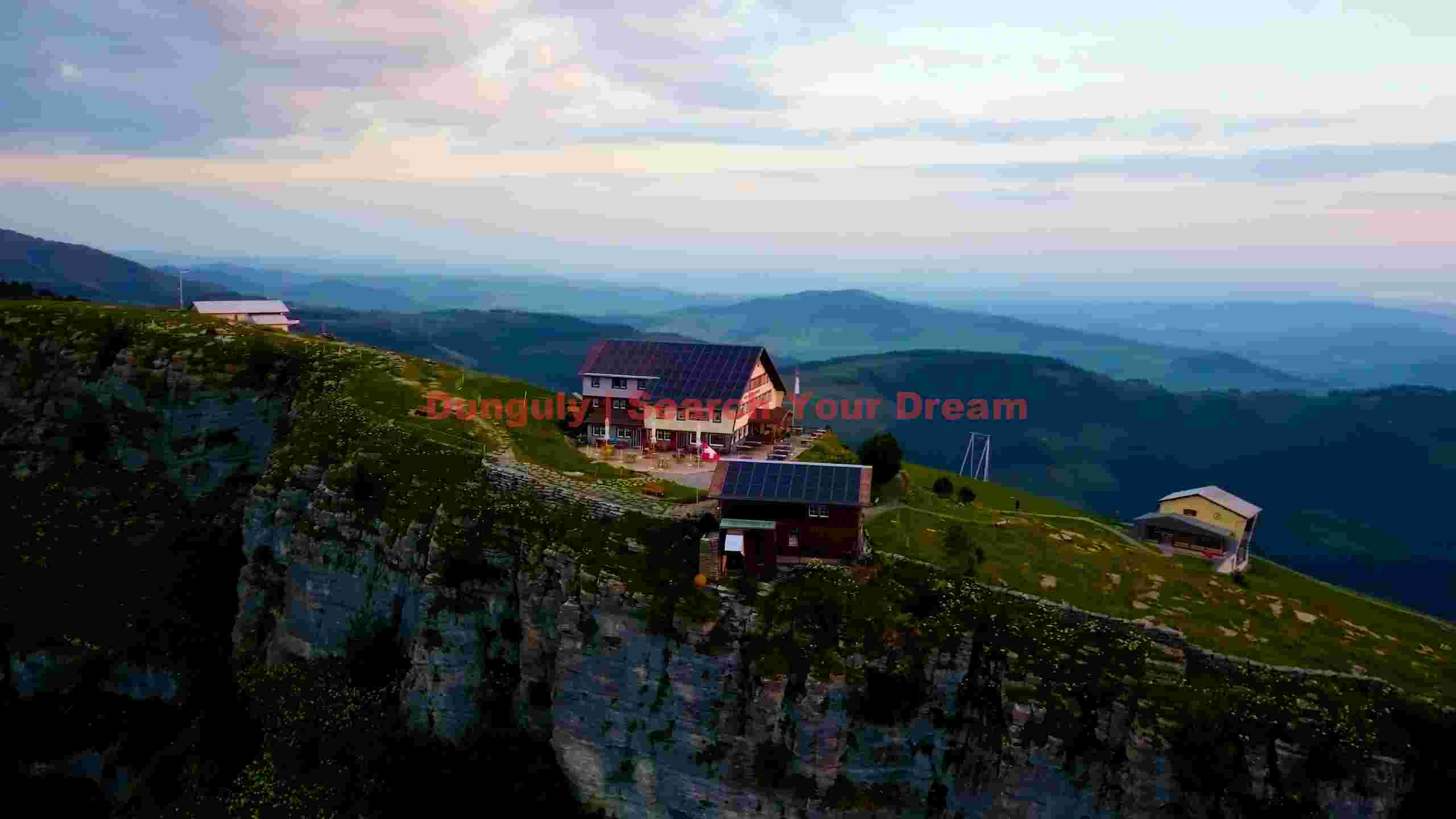 alpine retreat huts on a dramatic cliffside alpine retreat huts on a dramatic cliffside