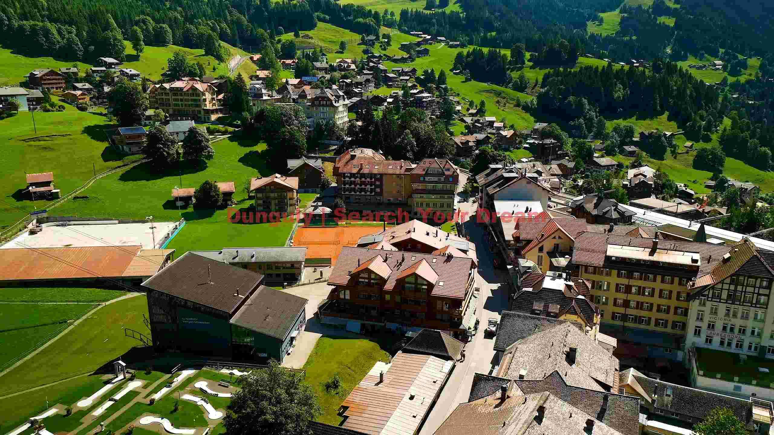 alpine village nestled in green mountain valley alpine village nestled in green mountain valley