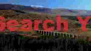 arching stone viaduct in a highland landscape