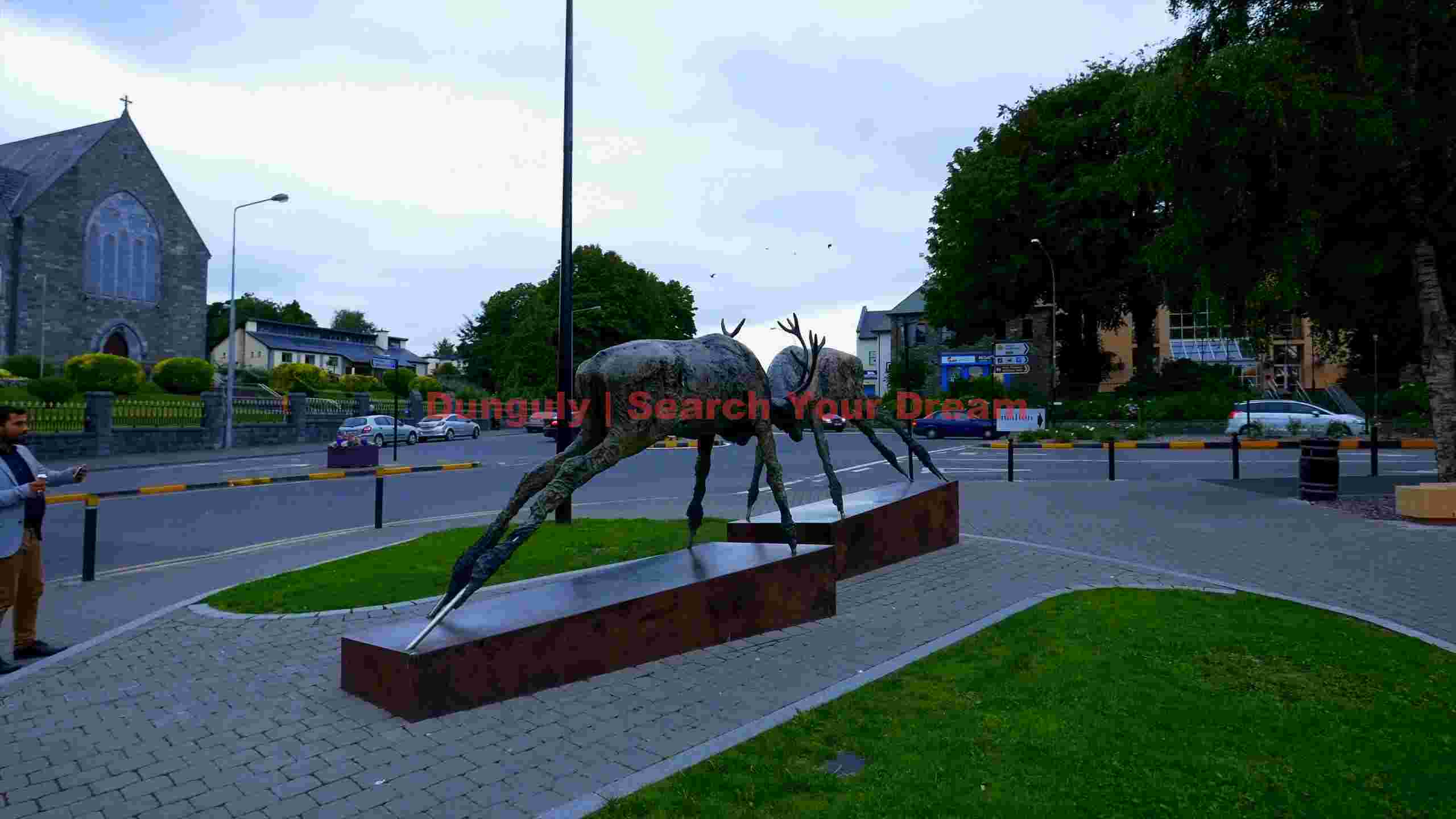 bronze deer sculpture in historic irish town square bronze deer sculpture in historic irish town square