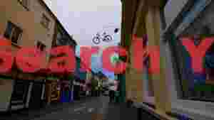 charming irish street scene with hanging bicycle decor