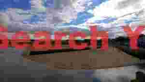 coastal beach town under dynamic clouds
