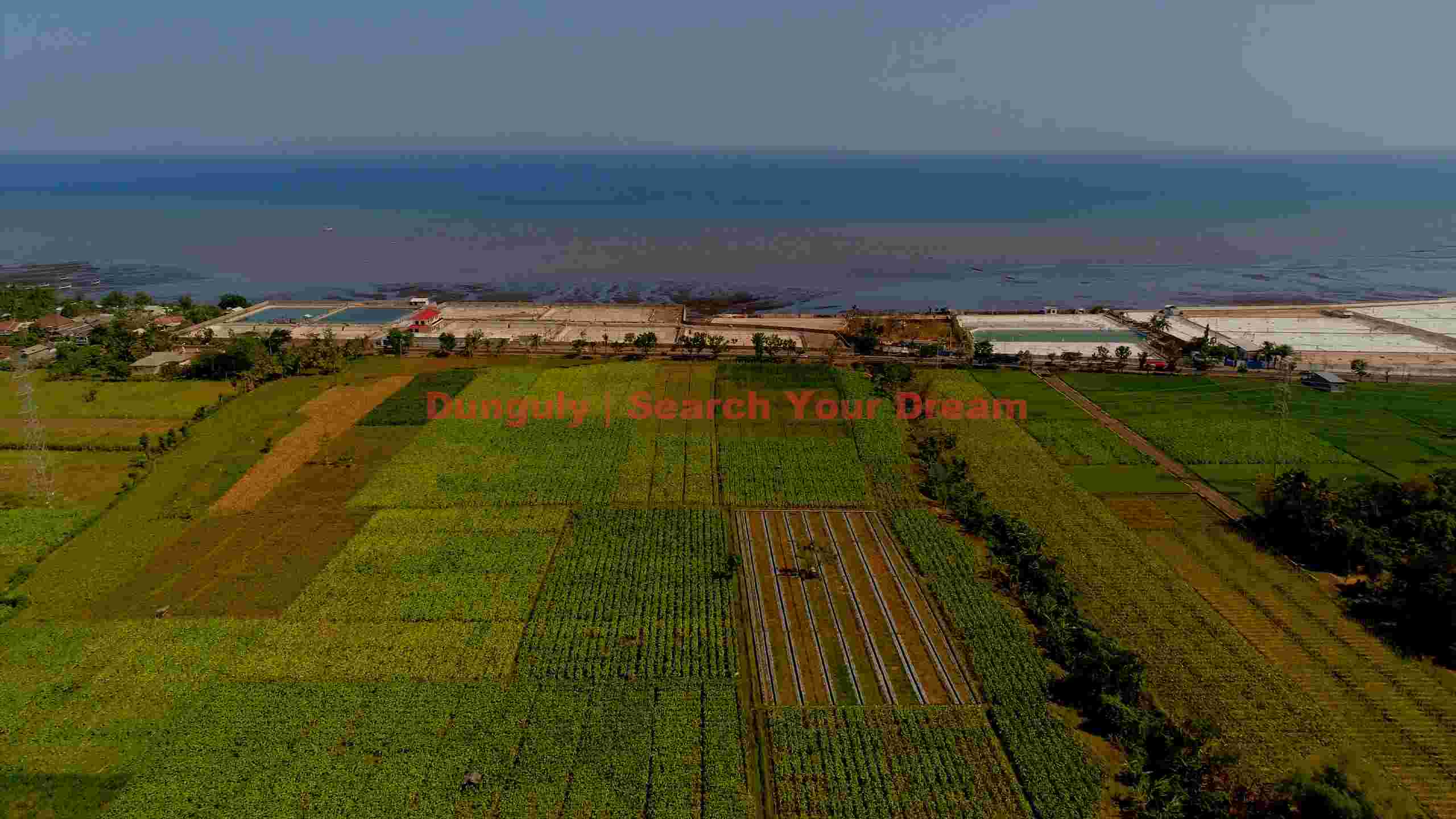 coastal farmlands and salt ponds aerial view coastal farmlands and salt ponds aerial view