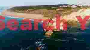 At Home dramatic coastal cliffs and expansive beach landscape