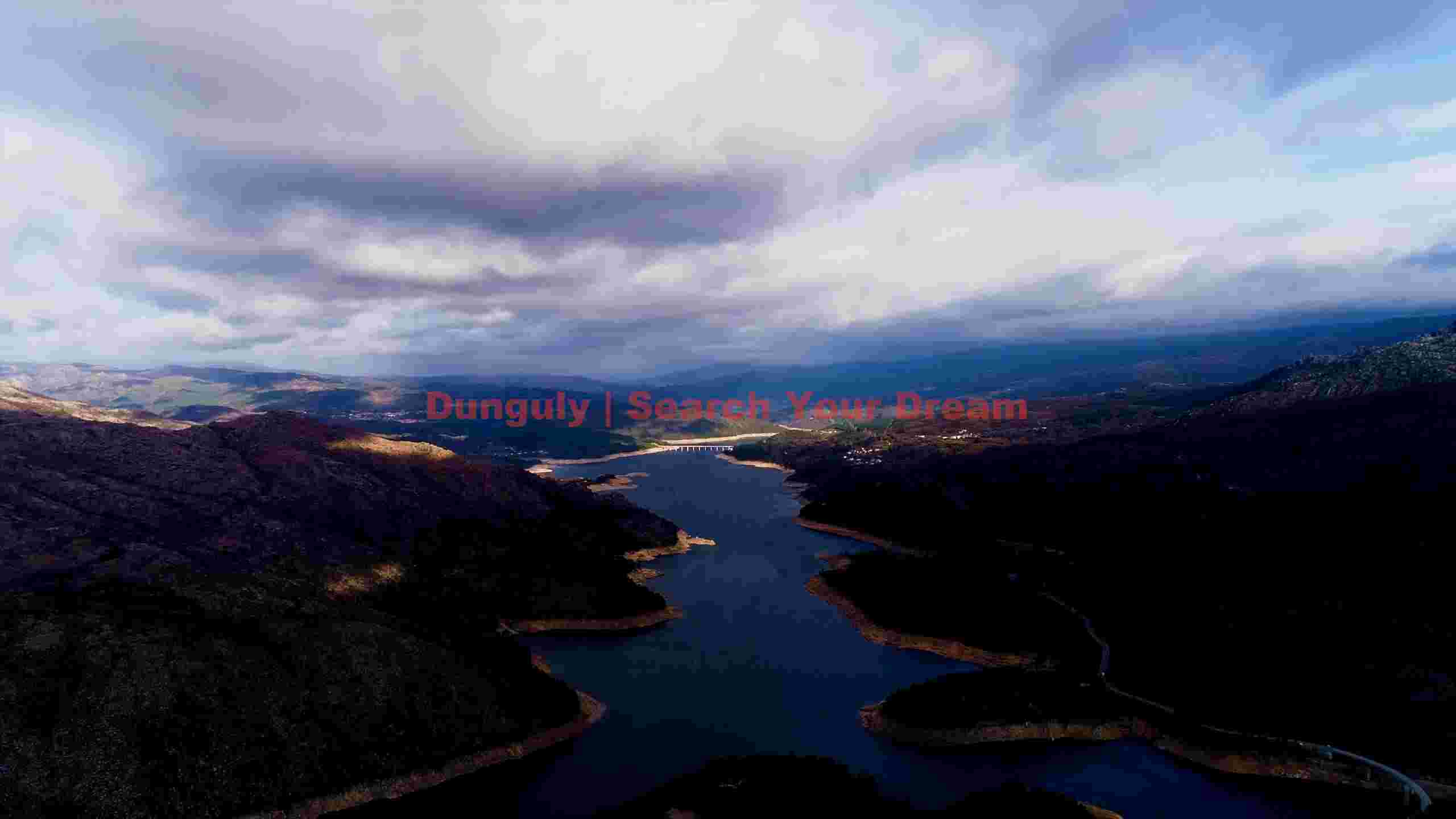 dramatic river valley aerial mountains and cloud dappled skies dramatic river valley aerial mountains and cloud dappled skies