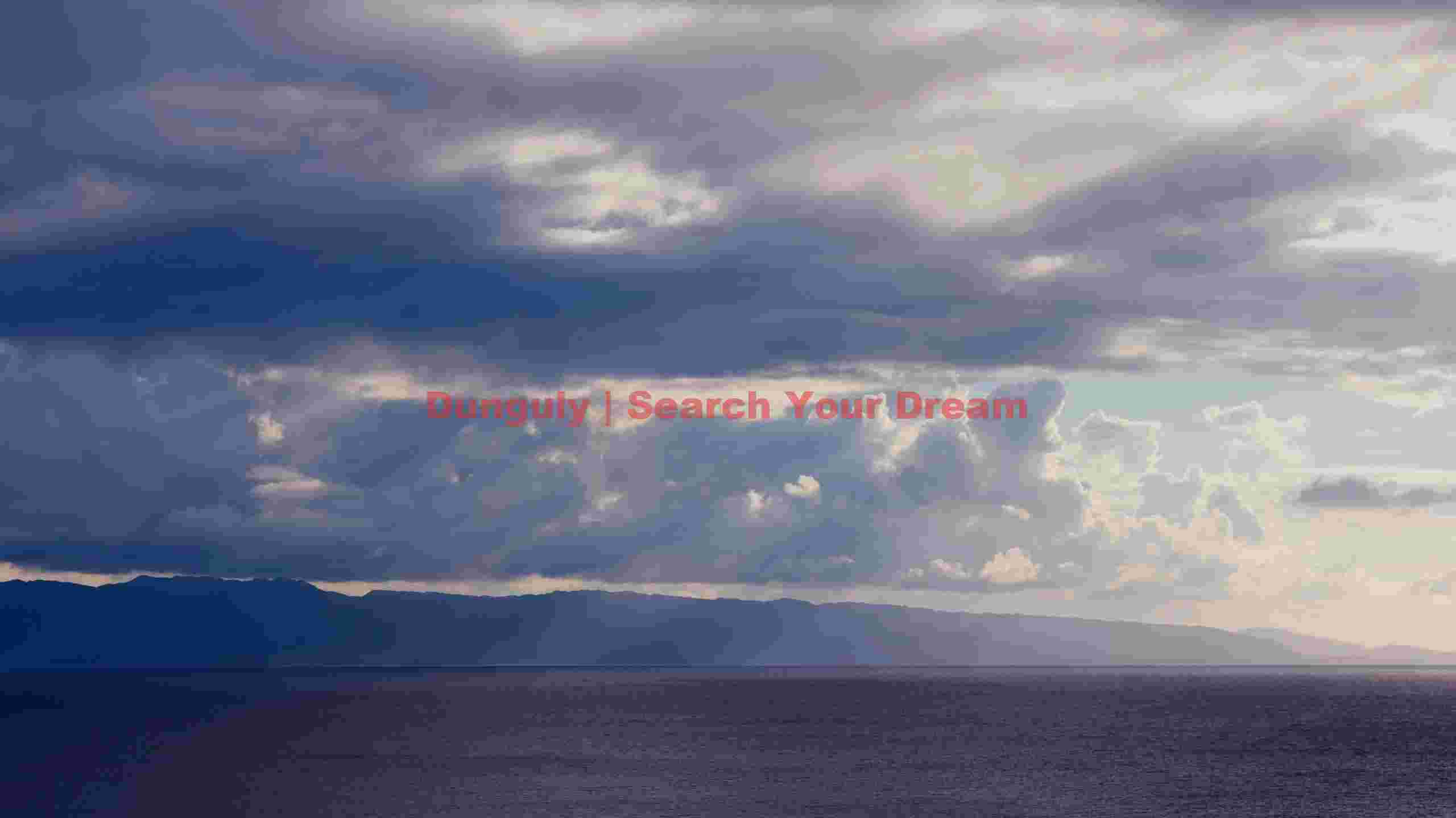 dramatic skies over serene ocean and distant mountains dramatic skies over serene ocean and distant mountains