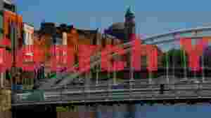 dublin cityscape hapenny bridge and liffey river