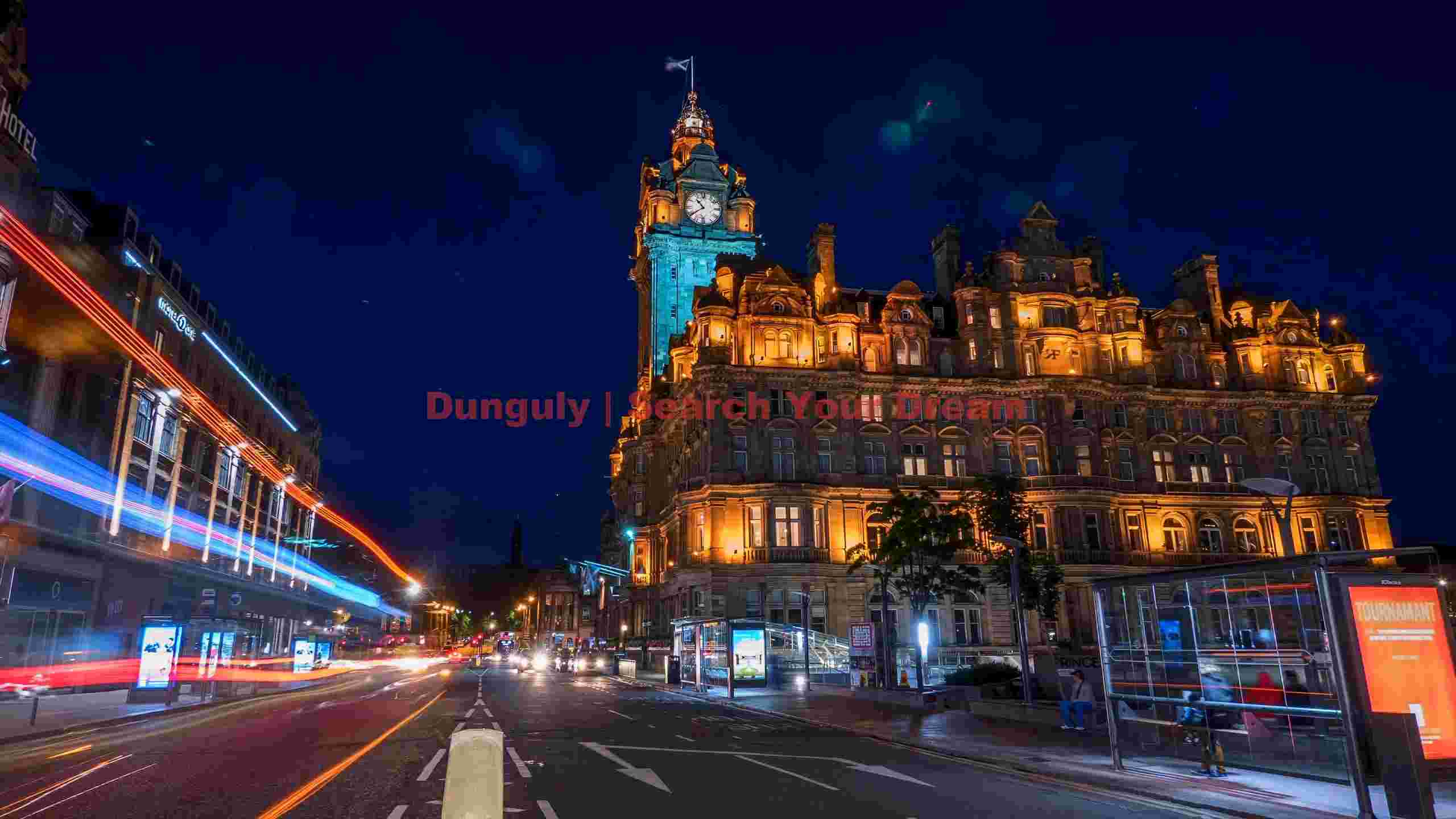 dynamic edinburgh night historic clock tower and urban light trails dynamic edinburgh night historic clock tower and urban light trails