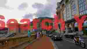 dynamic street scene in monaco with mountain backdrop