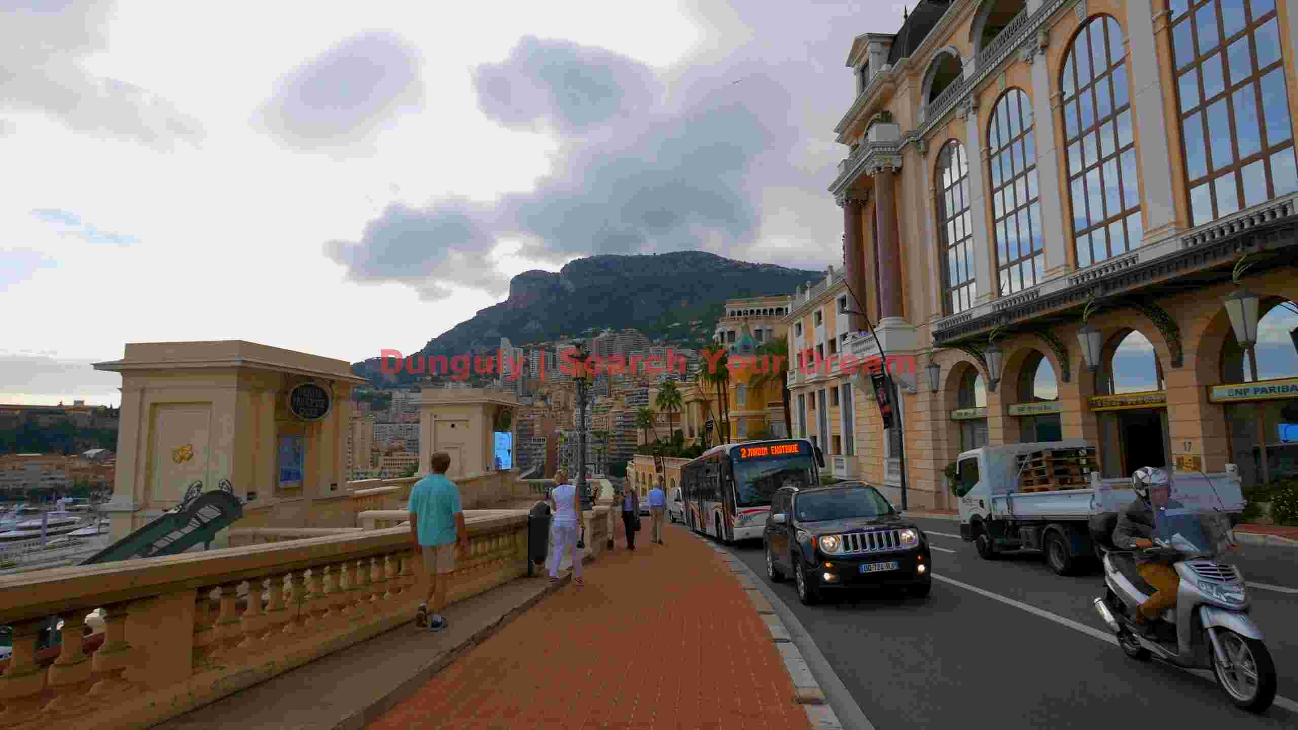 dynamic street scene in monaco with mountain backdrop dynamic street scene in monaco with mountain backdrop
