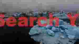 At Home ethereal glacial lagoon icebergs drifting in misty waters