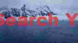 At Home glacial peaks over icy antarctic waters