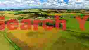 At Home golden fields and blue skies an aerial countryside vista