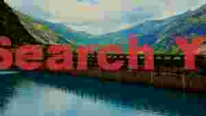 grand alpine dam and emerald lake landscape