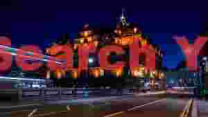 At Home grand illuminated city nightscape with dynamic light trails
