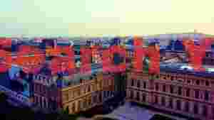 At Home grandeur of paris aerial louvre and sacry cur rooftops