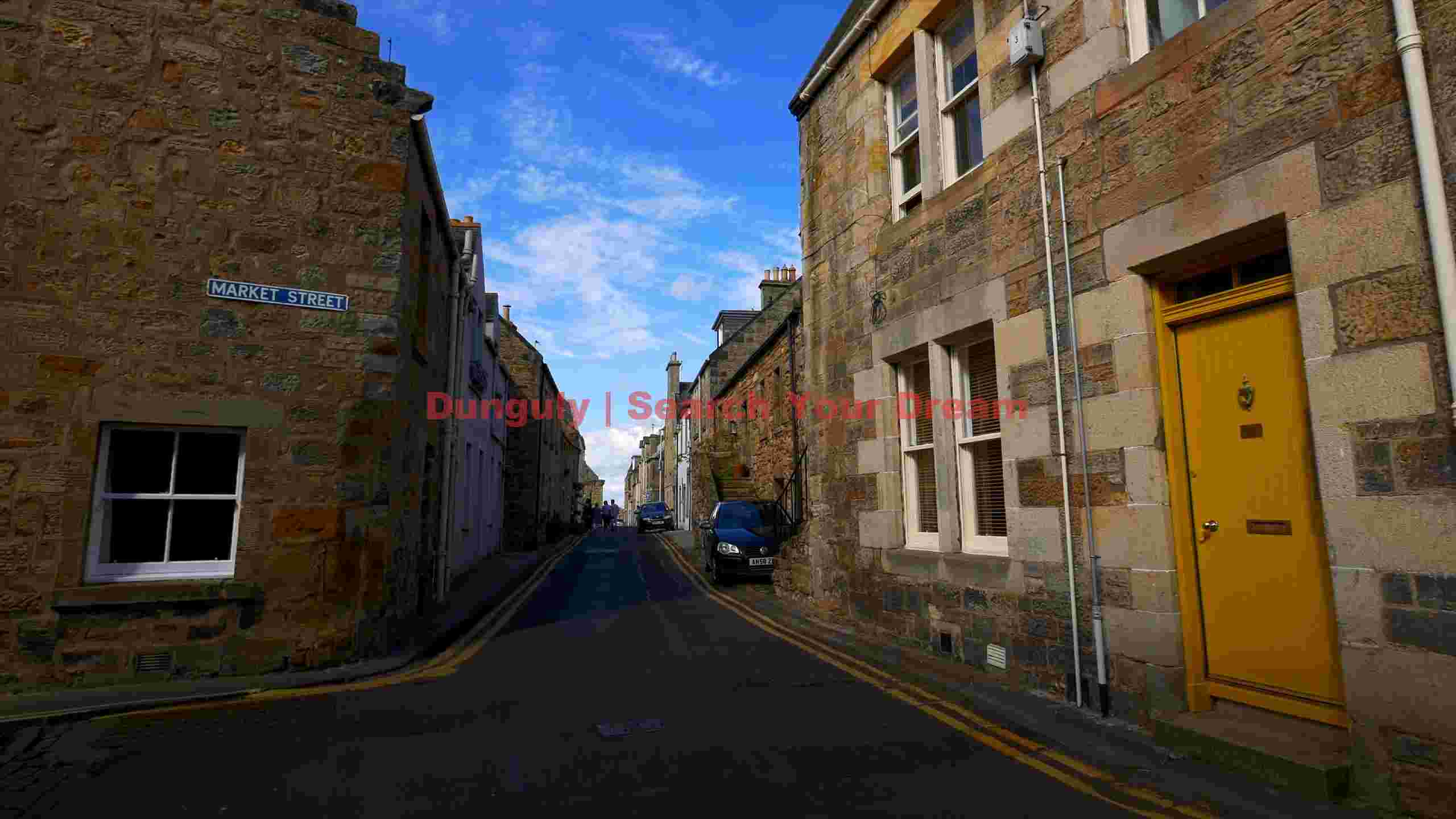 historic market street in stone with golden door historic market street in stone with golden door