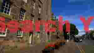 historic scottish stone architecture and street life