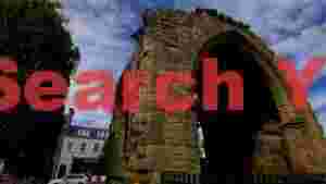 At Home historic stone archway and urban charm