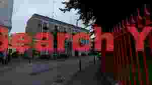 historic town hall streetscape with red fence
