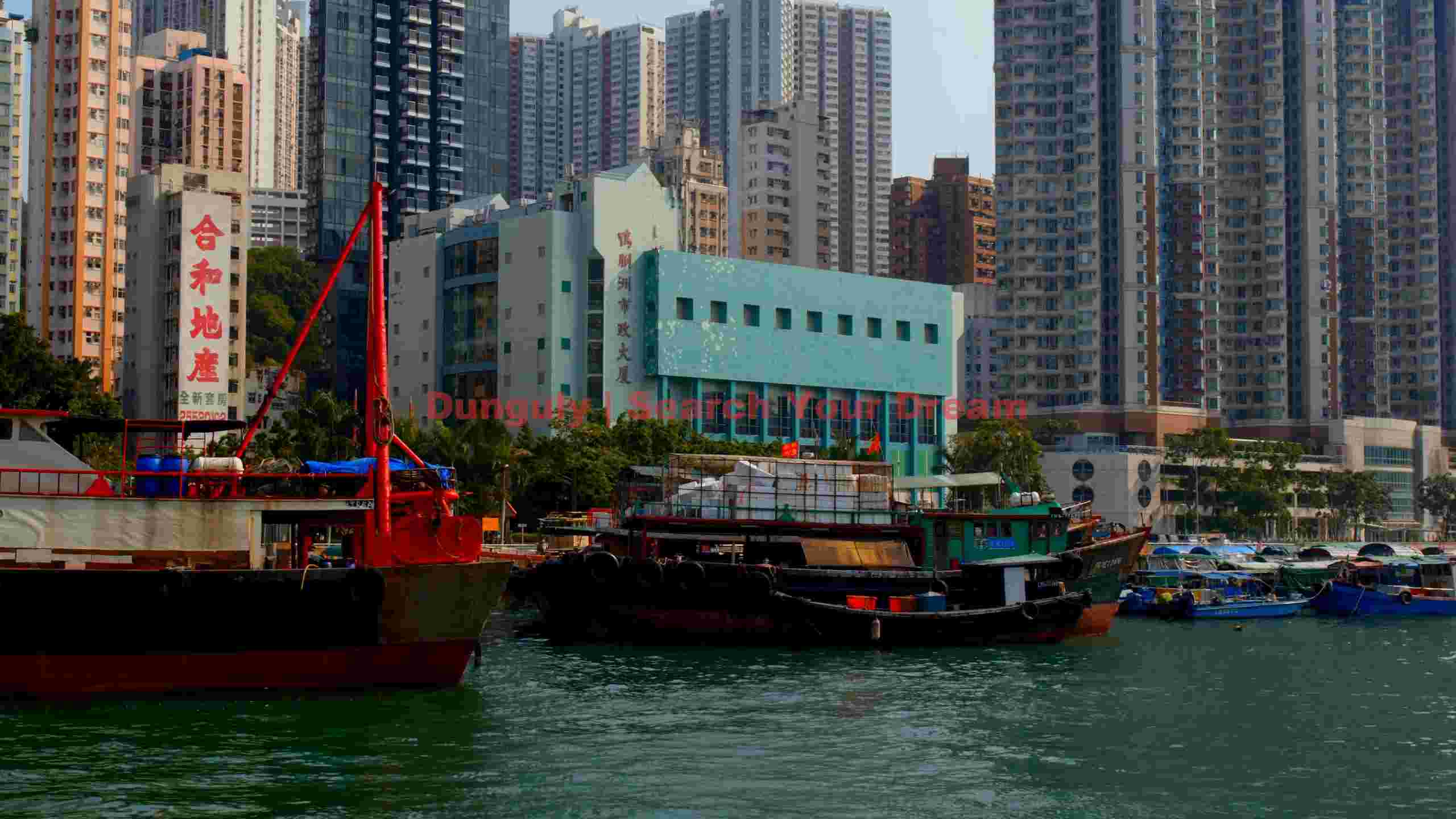 hong kong harbor urban vista with traditional boats hong kong harbor urban vista with traditional boats
