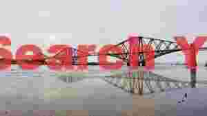 At Home iconic forth bridge reflected on calm waters