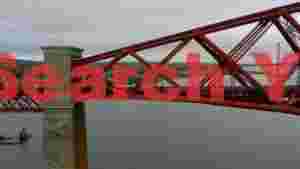 iconic forth bridge with train crossing