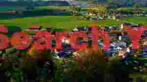 idyllic autumn village in green valleys