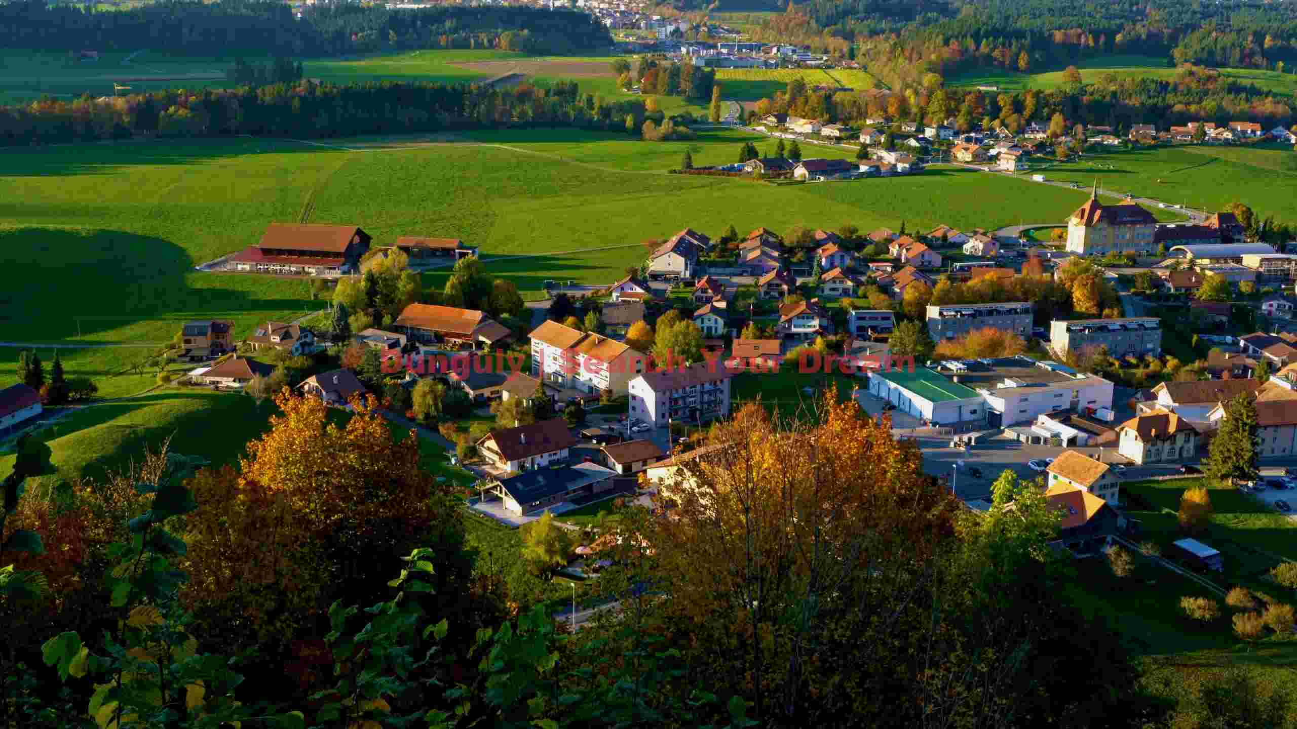 idyllic autumn village in green valleys idyllic autumn village in green valleys