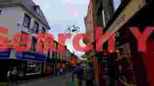 At Home killarneys charming street with suspended bicycles